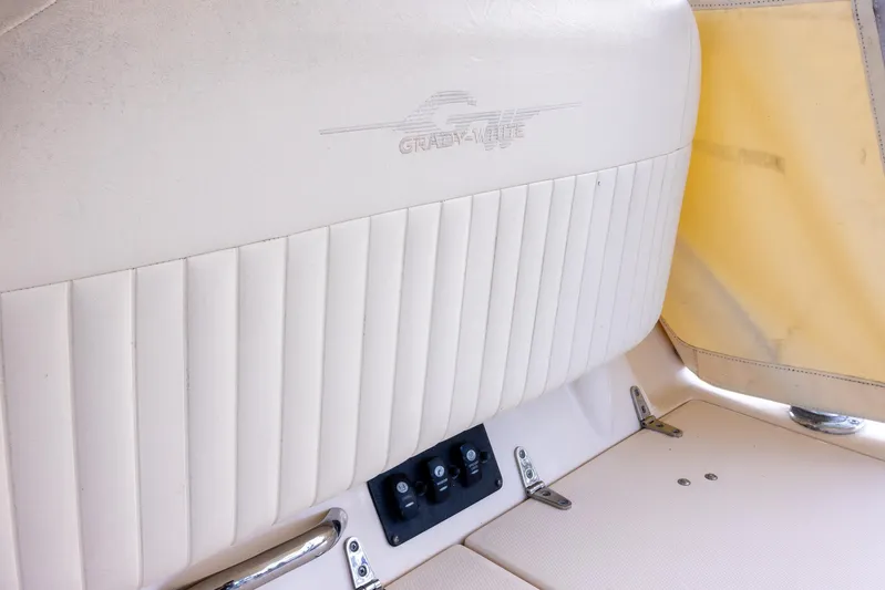  Yacht Photos Pics 2007 Grady-White Express 360 boat interior with beige seating and control panel.