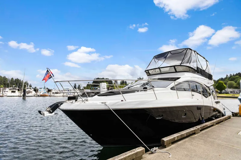  Yacht Photos Pics Sea Ray 400 Fly 2017 yacht docked at marina under blue sky.