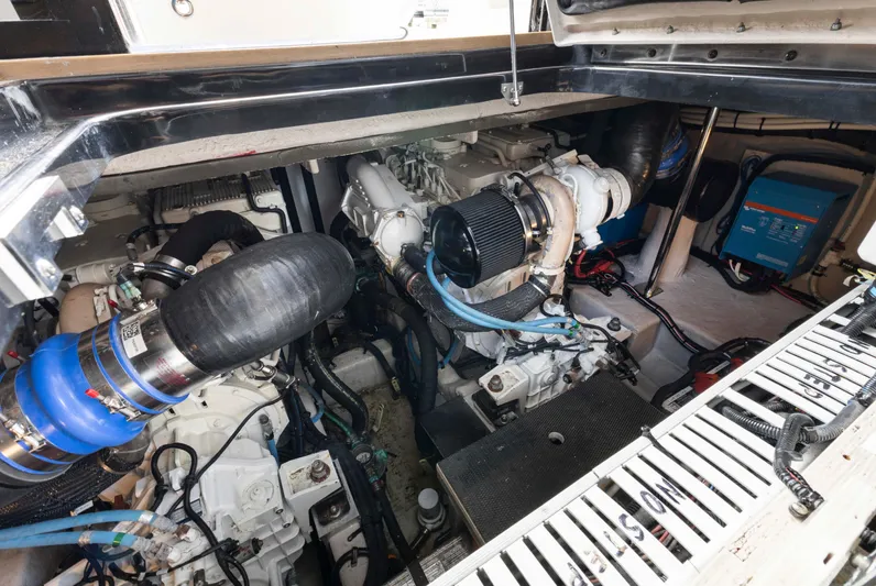  Yacht Photos Pics Engine room of a 2017 Sea Ray 400 Fly yacht, showcasing mechanical components.