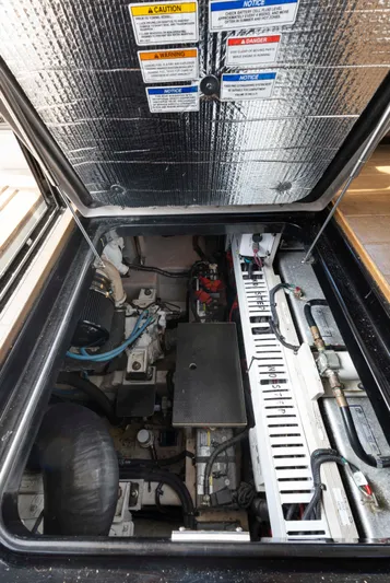  Yacht Photos Pics Engine compartment of 2017 Sea Ray 400 Fly yacht, showcasing mechanical components and wiring.