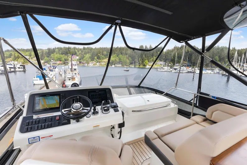  Yacht Photos Pics Flybridge view of 2017 Sea Ray 400 Fly yacht with marina backdrop.