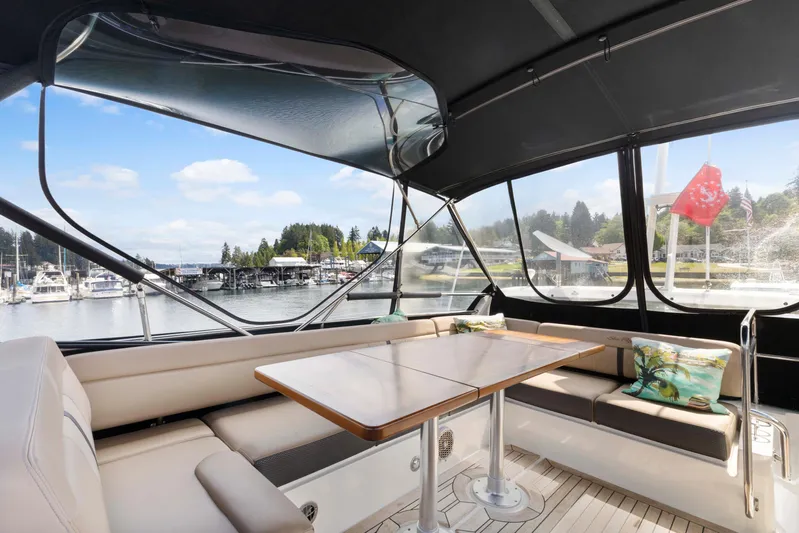  Yacht Photos Pics Interior view of 2017 Sea Ray 400 Fly yacht with seating and table.