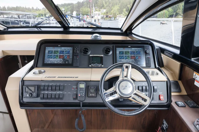  Yacht Photos Pics Helm of 2017 Sea Ray 400 Fly yacht with dual navigation screens and steering wheel.