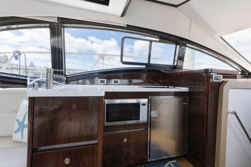  Yacht Photos Pics Interior of 2017 Sea Ray 400 Fly yacht with kitchenette and modern appliances.