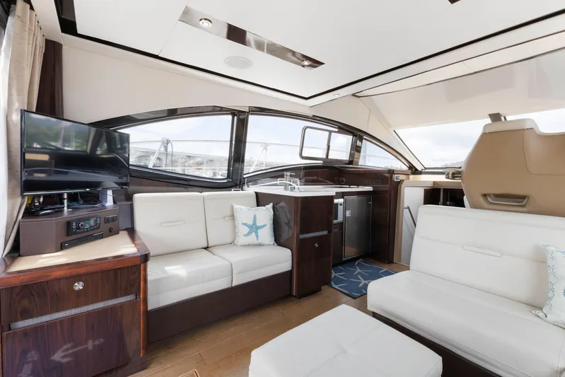  Yacht Photos Pics Luxurious interior of 2017 Sea Ray 400 Fly yacht with modern seating and elegant design.