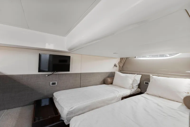  Yacht Photos Pics Interior of 2017 Sea Ray 400 Fly yacht with twin beds and wall-mounted TV.