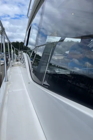  Yacht Photos Pics 2017 Sea Ray 400 Fly yacht, sleek design, docked under cloudy sky.