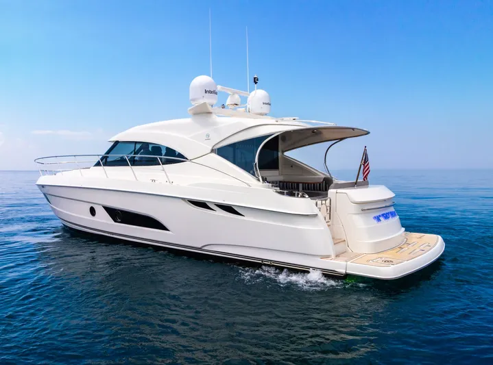 A Ro Boat Yacht Photos Pics 2019 Riviera 4800 Sport Yacht cruising on calm blue waters.