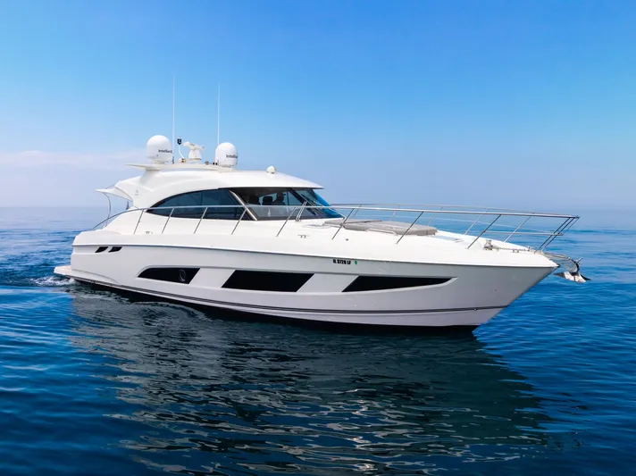 A Ro Boat Yacht Photos Pics 2019 Riviera 4800 Sport Yacht cruising on calm blue waters.