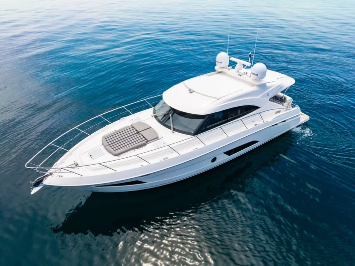 A Ro Boat Yacht Photos Pics 2019 Riviera 4800 Sport Yacht cruising on calm blue waters.