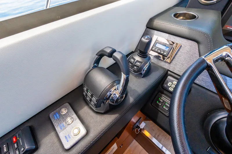 A Ro Boat Yacht Photos Pics Control panel of 2019 Riviera 4800 Sport Yacht with throttle and joystick.