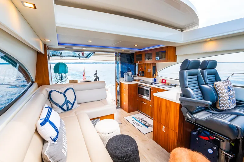 A Ro Boat Yacht Photos Pics Luxurious interior of 2019 Riviera 4800 Sport Yacht with plush seating and modern amenities.