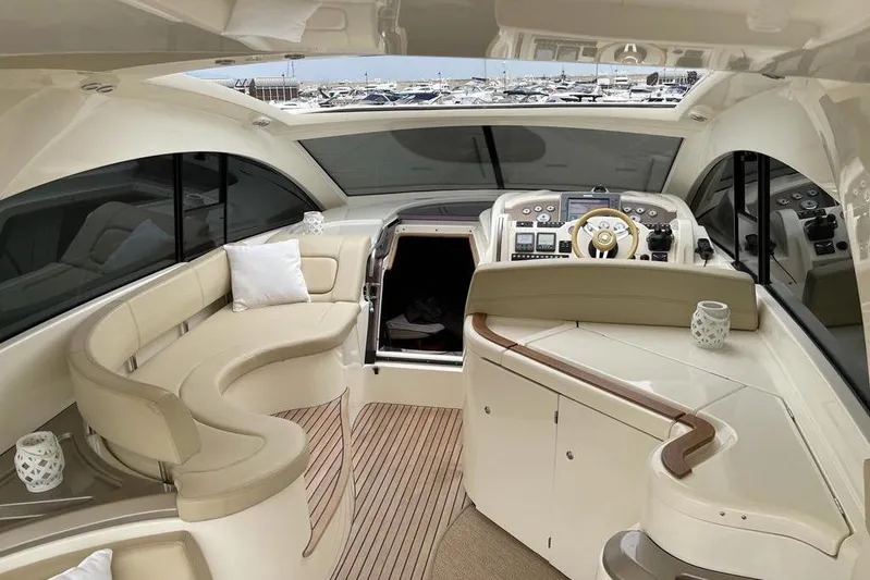  Yacht Photos Pics Luxurious 2009 Jeanneau Prestige 50 HT yacht interior with elegant seating and modern helm.