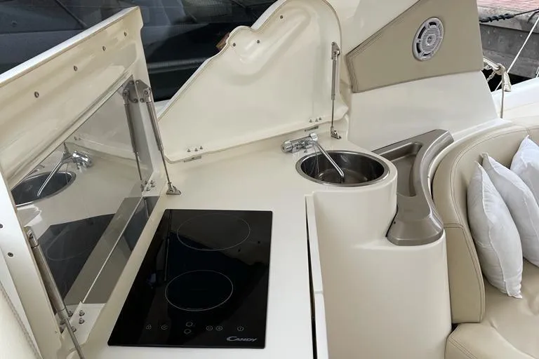  Yacht Photos Pics Interior of 2009 Jeanneau Prestige 50 HT yacht with modern kitchen amenities.