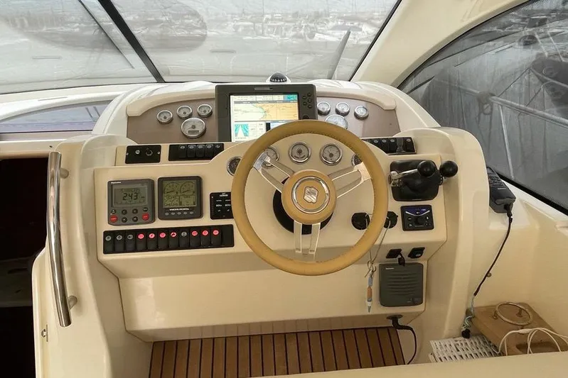 Yacht Photos Pics Helm of 2009 Jeanneau Prestige 50 HT yacht with navigation instruments and steering wheel.
