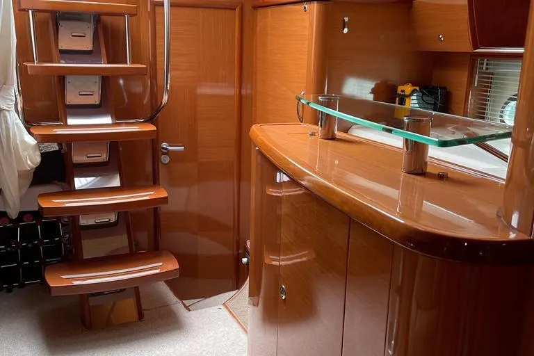  Yacht Photos Pics Interior of 2009 Jeanneau Prestige 50 HT yacht with polished wood and modern design.