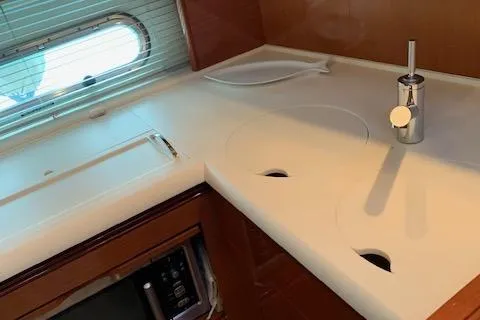  Yacht Photos Pics 2009 Jeanneau Prestige 50 HT yacht kitchen with sleek countertop and modern fixtures.