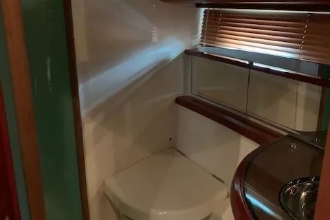  Yacht Photos Pics 2009 Jeanneau Prestige 50 HT yacht bathroom with modern fixtures and wooden accents.