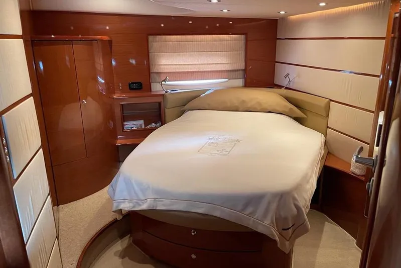  Yacht Photos Pics Luxurious cabin interior of 2009 Jeanneau Prestige 50 HT yacht with cozy bed and wood finish.