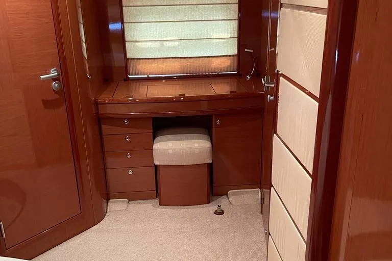  Yacht Photos Pics Luxurious interior of 2009 Jeanneau Prestige 50 HT yacht with wooden cabinetry and seating.