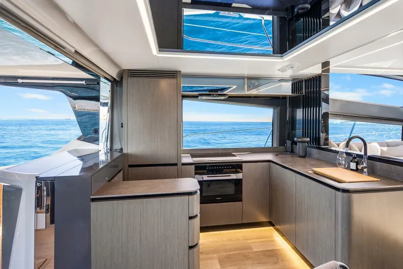  Yacht Photos Pics Luxurious kitchen interior of 2025 Pearl 63 yacht with ocean view.