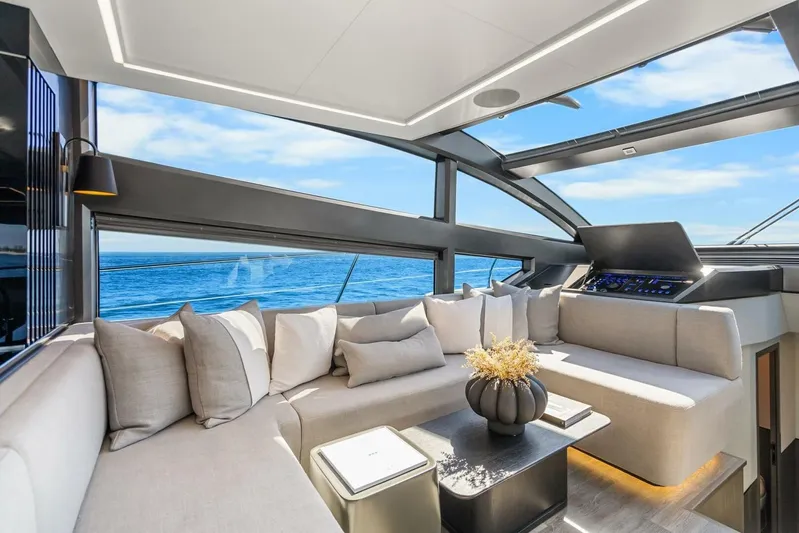  Yacht Photos Pics Luxurious interior of 2025 Pearl 63 yacht with ocean view and modern seating.