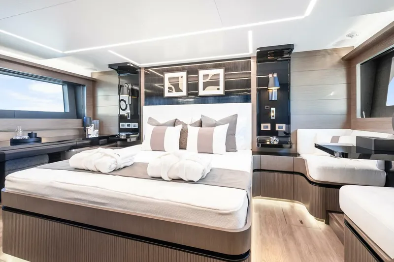  Yacht Photos Pics Luxurious bedroom interior of 2025 Pearl 63 yacht with modern design and elegant furnishings.