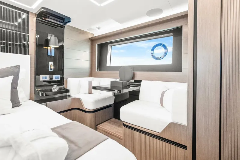  Yacht Photos Pics Luxurious interior of 2025 Pearl 63 yacht with modern seating and large window.