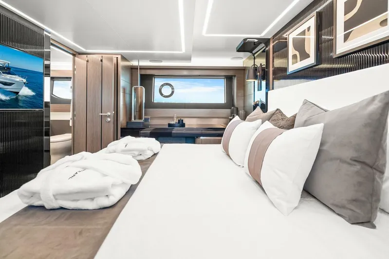  Yacht Photos Pics Luxurious bedroom interior of 2025 Pearl 63 yacht with modern decor and ocean view.