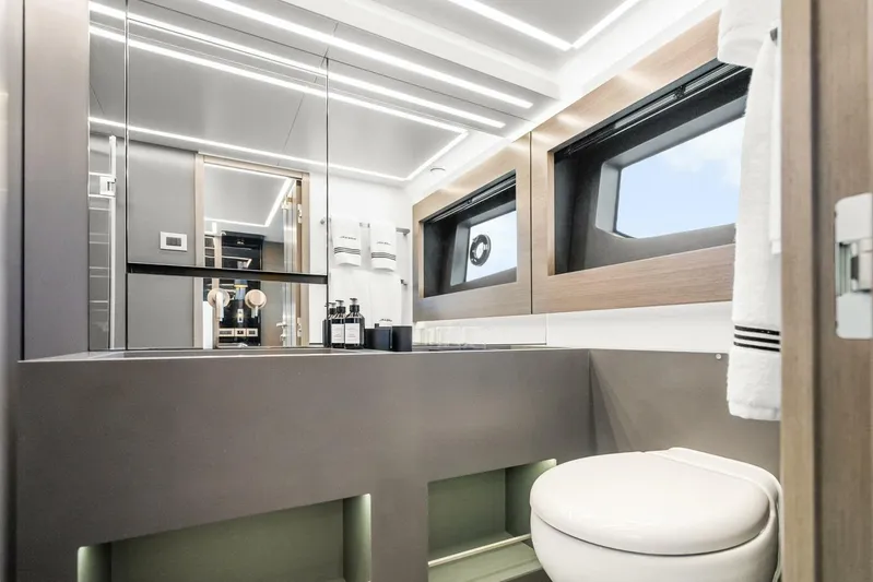  Yacht Photos Pics Luxurious bathroom interior of 2025 Pearl 63 yacht with modern fixtures and elegant design.