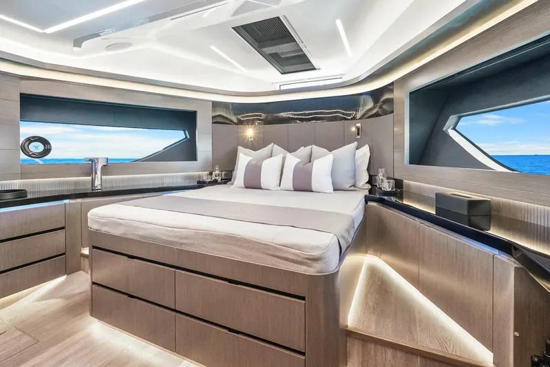  Yacht Photos Pics Luxurious bedroom interior of 2025 Pearl 63 yacht with modern design and ocean view.