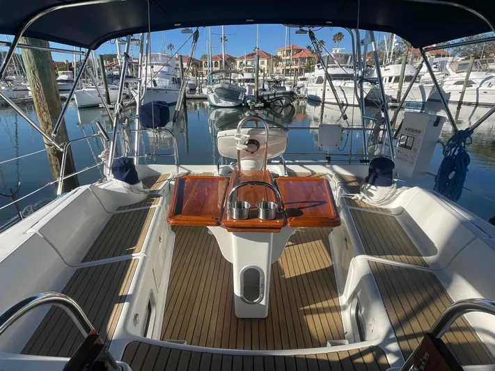 No Agenda Yacht Photos Pics 2003 Jeanneau Deck Salon yacht interior with wooden deck and marina view.
