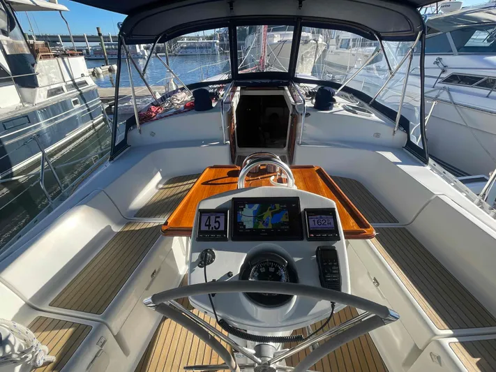 No Agenda Yacht Photos Pics 2003 Jeanneau Deck Salon yacht cockpit with navigation equipment and wooden accents.