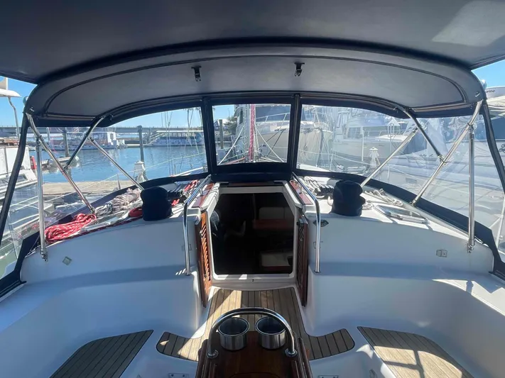 No Agenda Yacht Photos Pics 2003 Jeanneau Deck Salon sailboat cockpit with canopy, docked at marina.