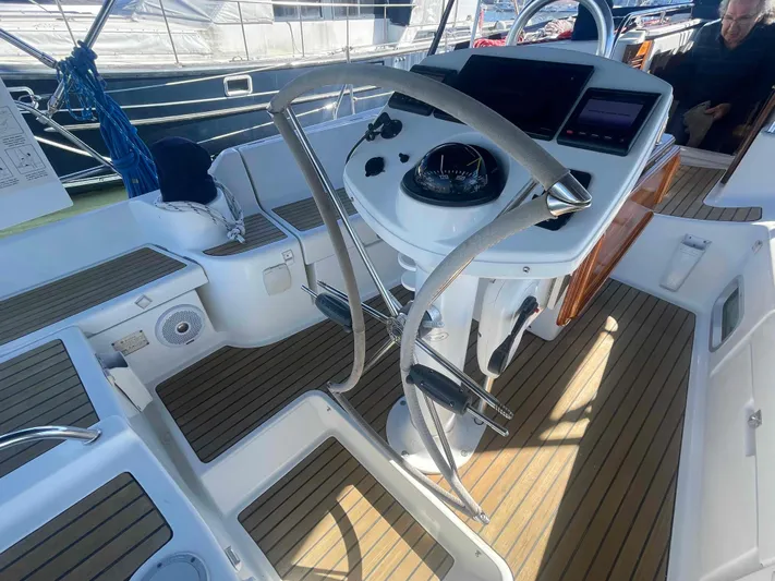 No Agenda Yacht Photos Pics 2003 Jeanneau Deck Salon cockpit with steering wheel and navigation instruments.