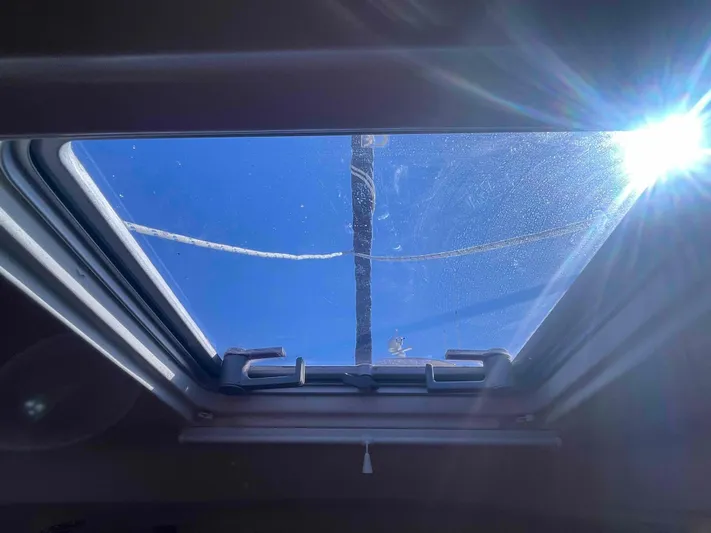 No Agenda Yacht Photos Pics Skylight view from 2003 Jeanneau Deck Salon, bright sun and clear blue sky.