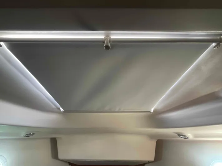 No Agenda Yacht Photos Pics Ceiling view of 2003 Jeanneau Deck Salon with modern lighting and sleek design.