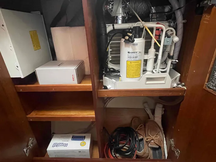 No Agenda Yacht Photos Pics Storage compartment in a 2003 Jeanneau Deck Salon, featuring equipment and supplies.