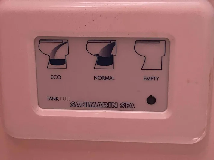 No Agenda Yacht Photos Pics Control panel for Santimarin SFA toilet with eco, normal, and empty options on a 2003 Jeanneau Deck Salon.