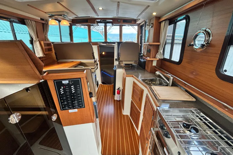  Yacht Photos Pics Interior of 2021 Ranger Tugs R-31 CB, featuring wood finishes and modern amenities.