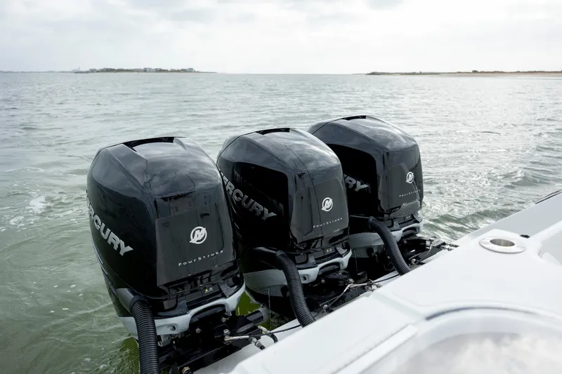  Yacht Photos Pics Triple Mercury outboard engines on 2024 SeaHunter 35 Tournament boat in open water.