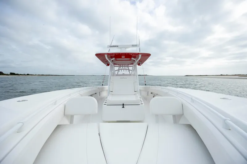  Yacht Photos Pics 2024 SeaHunter 35 Tournament boat on open water, showcasing sleek design and spacious deck.