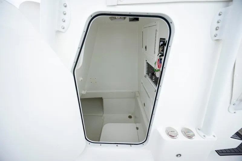  Yacht Photos Pics 2024 SeaHunter 35 Tournament boat interior compartment, featuring sleek white design and storage area.
