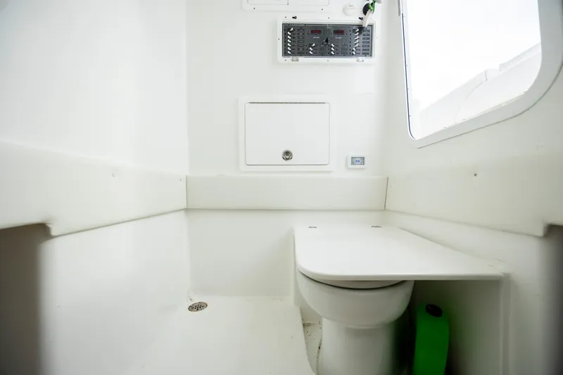  Yacht Photos Pics 2024 SeaHunter 35 Tournament boat interior with modern white bathroom amenities.