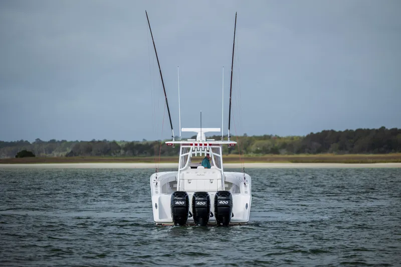  Yacht Photos Pics 2024 SeaHunter 35 Tournament boat with triple engines on open water.