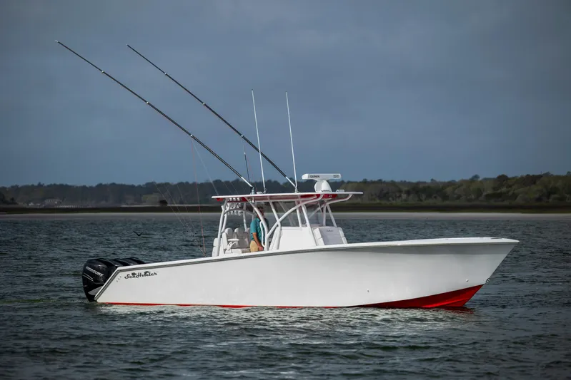  Yacht Photos Pics 2024 SeaHunter 35 Tournament boat on water, equipped with fishing rods.