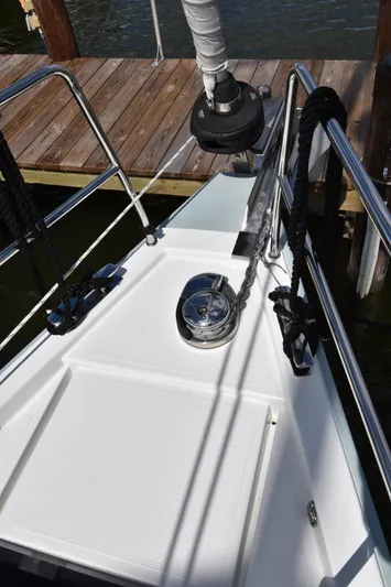 Maelynn Rose Yacht Photos Pics Bow of 2019 Hanse 458 yacht with anchor winch and railing.