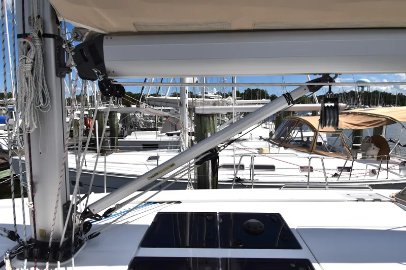 Maelynn Rose Yacht Photos Pics 2019 Hanse 458 sailboat deck with rigging and marina background.