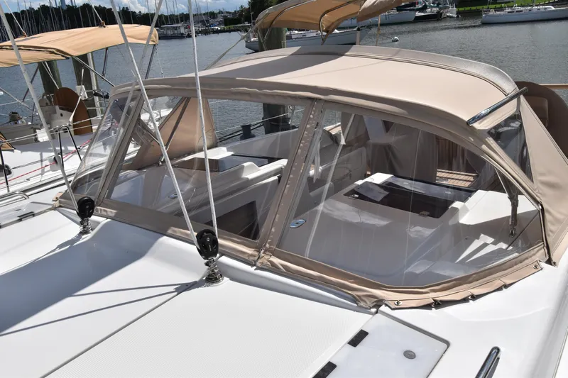 Maelynn Rose Yacht Photos Pics 2019 Hanse 458 yacht with beige canopy docked at marina.