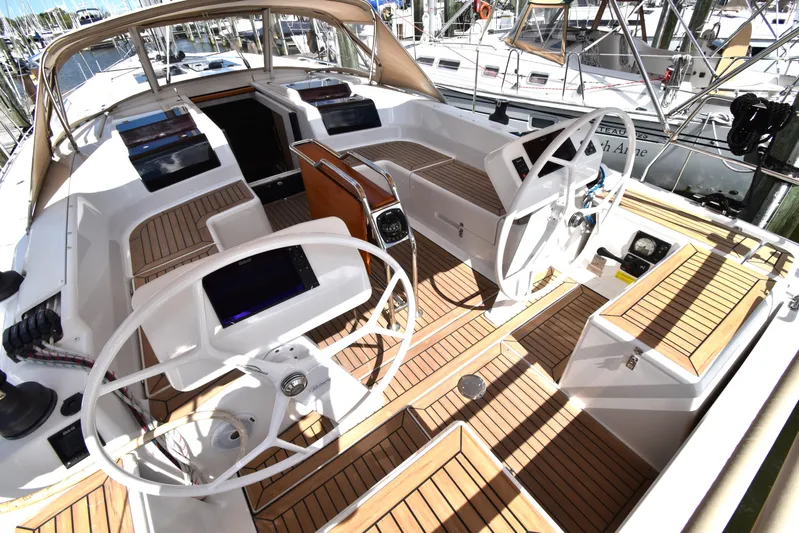 Maelynn Rose Yacht Photos Pics 2019 Hanse 458 yacht cockpit with dual steering wheels and teak flooring.